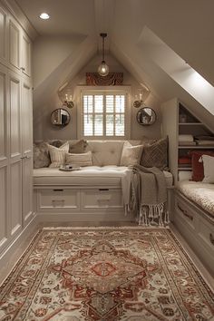 an attic bedroom with white walls and carpeted flooring, built - in storage area