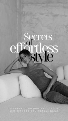 a woman sitting on top of a white couch in front of a wall with the words secrets