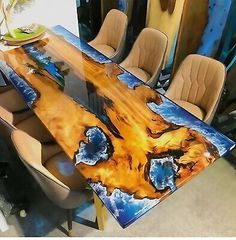 the table is made out of wood and has an artistic design on it's surface