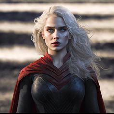 a woman with blonde hair and blue eyes wearing a red cape stands in front of a field