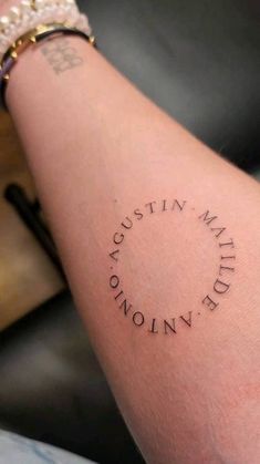 a person with a tattoo on their arm that says,'austin maths nolin