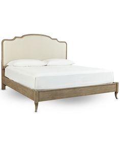 an upholstered bed with white linens and wooden headboard, on a white background