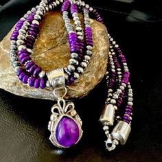 Masha Indian Native American Jewelry -On Route 66 - Albuquerque, New Mexico U.S.A Item Specifics          * Regional Style: Native American * Stone: Sugilite * Size: 20" * Pendant Size: 2" * Strands: 3 * Color: Purple * Tribal Affiliation: Navajo * Metal: Sterling Silver * Purity: 925 * Made in USA * SKU: 16304 Genuine Sterling Silver Jewelry This beautiful Necklace is made from all 925 Sterling Silver Beads and Findings.  These Beads are meticulously hand strung and assembled by the artist creating the perfect balance of fall, color and shine. Necklaces are a must have for any collection, whether you are just starting out or are a serious collector you will not be disappointed with this work of art. These necklaces have excellent fall and can even be stacked with others, fashioned with a Artisan Purple Round Bead Jewelry, Artisan Purple Round Beaded Jewelry, Purple Southwestern Jewelry For Gifts, Purple Southwestern Jewelry For Gift, Southwestern Style Purple Jewelry For Gift, Purple Southwestern Style Jewelry For Gift, New Mexico Usa, Albuquerque New Mexico, Native American Artists