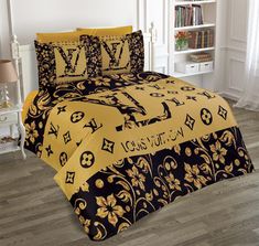 a bed with yellow and black comforters in a room next to a book shelf