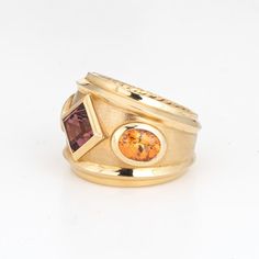 This is part of Chairish’s Fine Jewelry assortment.  Estate David Yurman Renaissance ring crafted in 18 karat yellow.    The out of production David Yurman ring is set with a center set Rhodolite garnet measuring 6mm. Two citrines measure 7mm x 5.5mm. The gemstones are in very good condition and free of cracks or chips. Weighing a hefty 16.6 grams the ring makes a great statement on the hand. The ring has a medium rise (6.5mm - 0.25 inches).  The ring is in very good condition and was recently l Luxury Yellow Sapphire Multi-stone Ring, Luxury Yellow Gold Ring Gemstone, Fine Jewelry Yellow Gold Multi-stone Ring, Yellow Gold Multi-stone Rings Fine Jewelry, Luxury Gold Sapphire Ring With Accent Stones, Fusion Style Multi-stone Yellow Gold Gemstones, Yellow Gold Multi-stone Fusion Gemstones, Luxury Yellow Gold Amethyst Ring With Bezel Setting, Heirloom Yellow Gold Rings With Yellow Sapphire