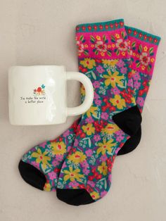 two pairs of socks and a coffee mug