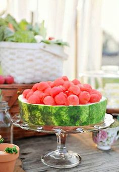 watermelon in a bowl on a table with other pictures and words below it