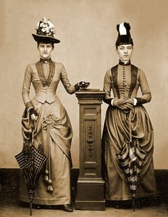 This reprint of a vintage photograph shows Two Women with Umbrellas in 1870.    Size 8.5" x 11"    Printed on premium luster photo paper for a highly detailed finish, without the glare.    Suitable for framing, matting and mounting    Your item will be printed using Canon Professional inks, for a smudge free, fade resistant, long lasting print    Print will be packaged in a moisture resistant sleeve and then shipped in a heavy, flat, rigid mailer.    Printed from a very high resolution scan ( mu 1870 Fashion, Victorian Photography, 1870s Fashion, Victorian Costume, Goth Decor, 19th Century Fashion, Victorian Clothing, Victorian Women, Fashion Hacks