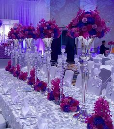 the tables are decorated with purple and red flowers