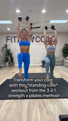 two women doing exercises with dumbbells on their hands and arms in the air