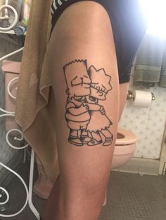 a person with a tattoo on their leg holding onto another person's arm in the bathroom