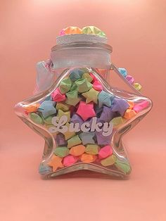 a star shaped bottle filled with colorful candies