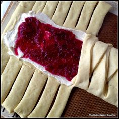 homemade pita bread with cranberry sauce on top, ready to go into the oven