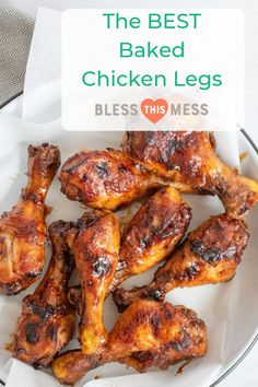 the best baked chicken legs on a plate with text overlay that reads, the best baked chicken legs