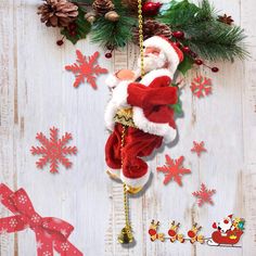 a santa clause hanging from the side of a wooden wall with christmas decorations around it