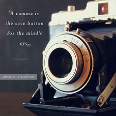 an old camera sitting on top of a table next to a quote about the camera