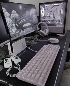 a computer desk with two monitors and a keyboard on top of it next to a game controller