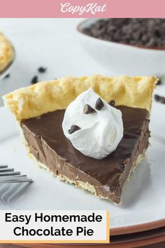 a slice of chocolate pie on a plate with whipped cream and chocolate chips around it