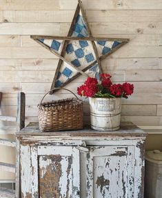 a potted plant sitting on top of an old cabinet next to a star decoration