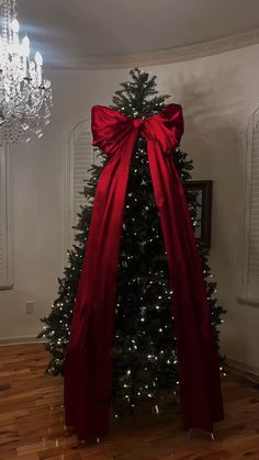 a christmas tree with a red bow on it