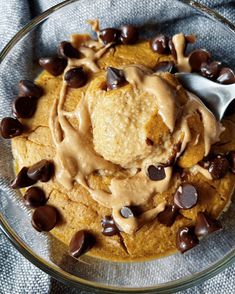 a glass bowl filled with cookie dough and chocolate chips