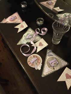 the table is covered with decorative items and paper decorations, such as bunting banners