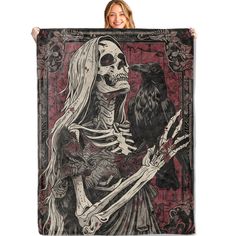 a woman holding up a skeleton with a raven on her arm