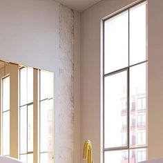 a bath room with a tub and a window