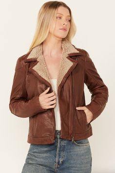 Jenja Jacket Premium leather jacket with fur trim. Color: cognac Moto style Sherpa collar Front zipper closure Welt hand warmer pockets on side Lined Model is wearing a size Small Leather Jacket With Fur, Womens Sherpa, Jacket With Fur, Fur Leather Jacket, Moto Style, Crop Top Sweater, Leather Moto, Leather Moto Jacket, Dress Hats