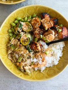 two bowls filled with rice and vegetables on top of a table