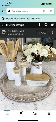 an image of a tray with utensils and flowers in it on the table