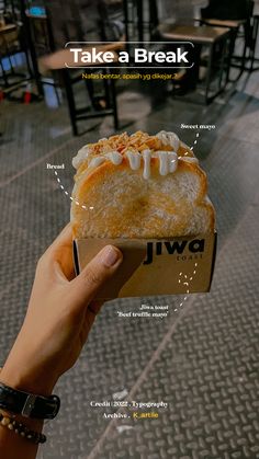 a person holding up a piece of bread with toppings on it and the words take a break above it