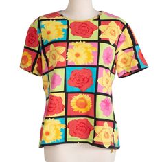 Cute color-block top with bright flower pattern. Material is soft and stretchy. Original tag is gone/faded, however we image searched and found this top was made for Laurel by Escada in the 90s.  Measurements Bust: 42" Waist: 38" Length: 23" Shoulder-to-Shoulder: 16.5" Condition: Excellent vintage condition! Multicolor Color Block Tops For Spring, Retro Spring Color Block T-shirt, Colorful Fitted Color Block Top, Spring Retro Color Block T-shirt, Retro Color Block T-shirt For Spring, Fitted Color Block Tops, Casual Fitted Tops With Floral Patchwork, Fitted Multicolor Floral Patchwork Tops, Casual Multicolor Floral Patchwork Tops