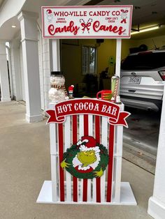 a candy bar sign in front of a building