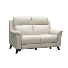 a white leather reclining sofa with black legs and arm rests on an isolated white background