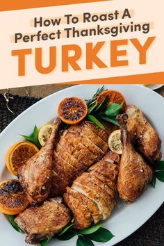 how to roast a perfect thanksgiving turkey on a white plate with oranges and herbs