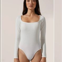 Brand: Astr Size: 1x Color: Ivory Condition : New With Tags, Excellent. This Bodysuit Features A Square Neckline And Long Sleeves. Attached Bottoms Have Snap Button Closures. Please Ask All Questions As All Sales Are Final. Cream Fitted Bodysuit For Loungewear, White Stretch Bodysuit For Loungewear, White Fitted Bodysuit For Loungewear, Fitted White Bodysuit For Loungewear, White Fitted Loungewear Bodysuit, White Bodysuit For Spring Loungewear, Bustier Bodysuit, Metallic Bodysuit, Square Neck Long Sleeve