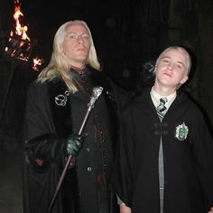 two people dressed in harry potter costumes