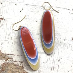 Ombre' resin that looks like agate, drop earrings made of vintage parts from India - made in the 1970's. Rusty orange meets yellow, white & a touch of blue. These pieces are similar to Fordite in the polished layers of color. Earwires are hypoallergenic and 24k frosted gold plated. Each earring measures about 3.5" from end to end. Earrings are made with vintage lucite & resin parts, originally created for the jewelry industry between the early 60's through the early 80's. No new plastics Cheap Vintage Orange Earrings, Retro Teardrop Earrings, Retro Teardrop Earrings As Gift, Retro Handmade Orange Earrings, Handmade Retro Orange Earrings, Retro Multicolor Hand Painted Earrings, Retro Hand Painted Multicolor Earrings, Mid-century Handmade Earrings As Gift, Handmade Mid-century Style Earrings For Gifts