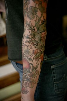 a person with a flower tattoo on their arm