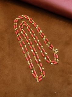 sizes in terms of height and weight are mentioned in grams and inches in the photo Gold Double Strand Jewelry For Festive Occasions, Festive Double Strand Gold Necklace, Festive Gold Double Strand Necklace, Festive Gold Long Mala Necklace, Festive Long Gold Mala Necklace, Festive Red Mala For Puja, Gold Mala With Tilla And Round Beads, Gold Mala With Tilla For Puja, Festive Gold Beaded Chain