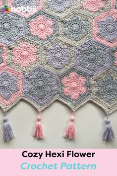 the crochet hexa flower is shown with tassels on each side