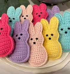 small crocheted bunnies are on a plate