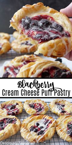 blueberry cream cheese puff pastry is being held up to show the filling on it