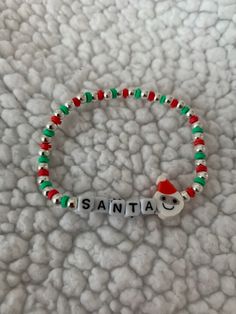 a bracelet with the word santa written on it