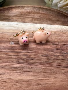 Dangly earrings with a cute resin piggy charm. A fun gift or stocking filler for pig lovers!  Stainless steel ear wire in gold colour with resin pig charm and silicone stopper. Pig Earrings, Cute Pig, Pig Lovers, Cute Pigs, Dangly Earrings, Gold Colour, Stocking Filler, Stocking Fillers, Etsy Earrings Dangle