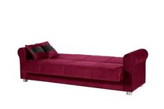 a red couch with two pillows on it