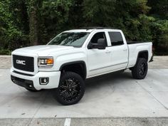 a white truck parked in a parking lot