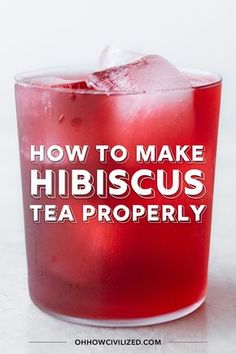 a red drink in a glass with the words how to make hibiscus tea properly