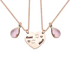 two pieces of heart shaped necklace with the words,'love is in the air '